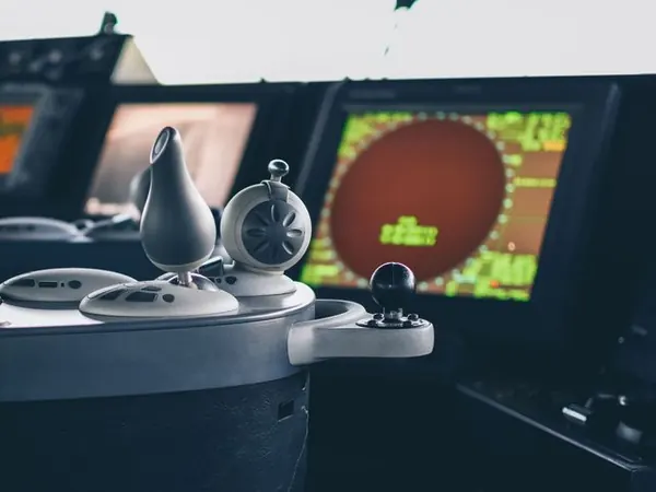 Radar and ECDIS displays on a ship bridge